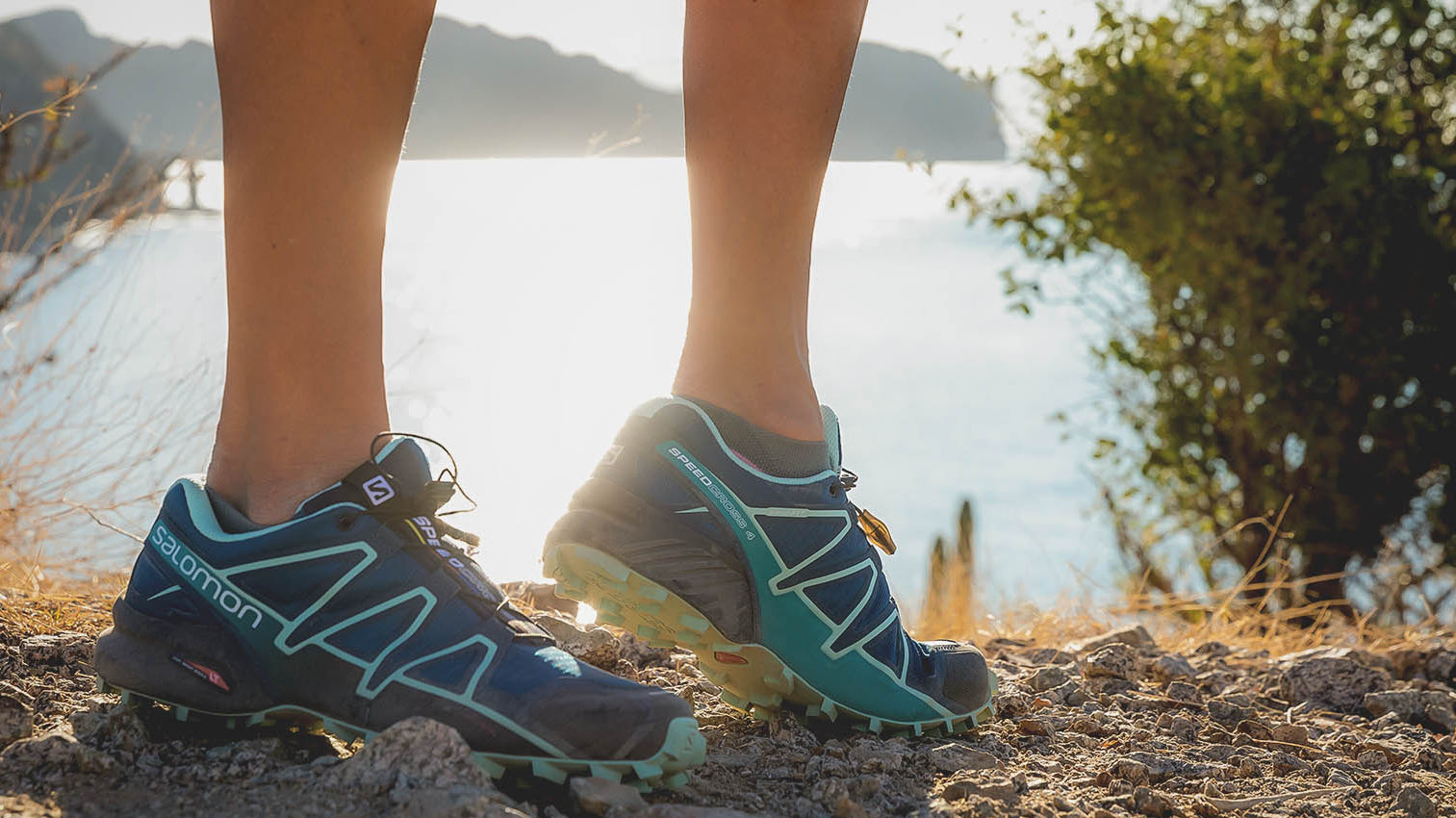 Person standing on dirt with hiking sneakers