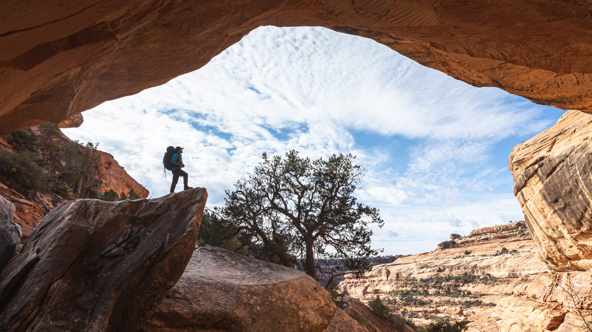 Man enjoying a hike with the basic hiking gear for beginners