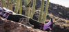 woman lying down in desert with fitted socks