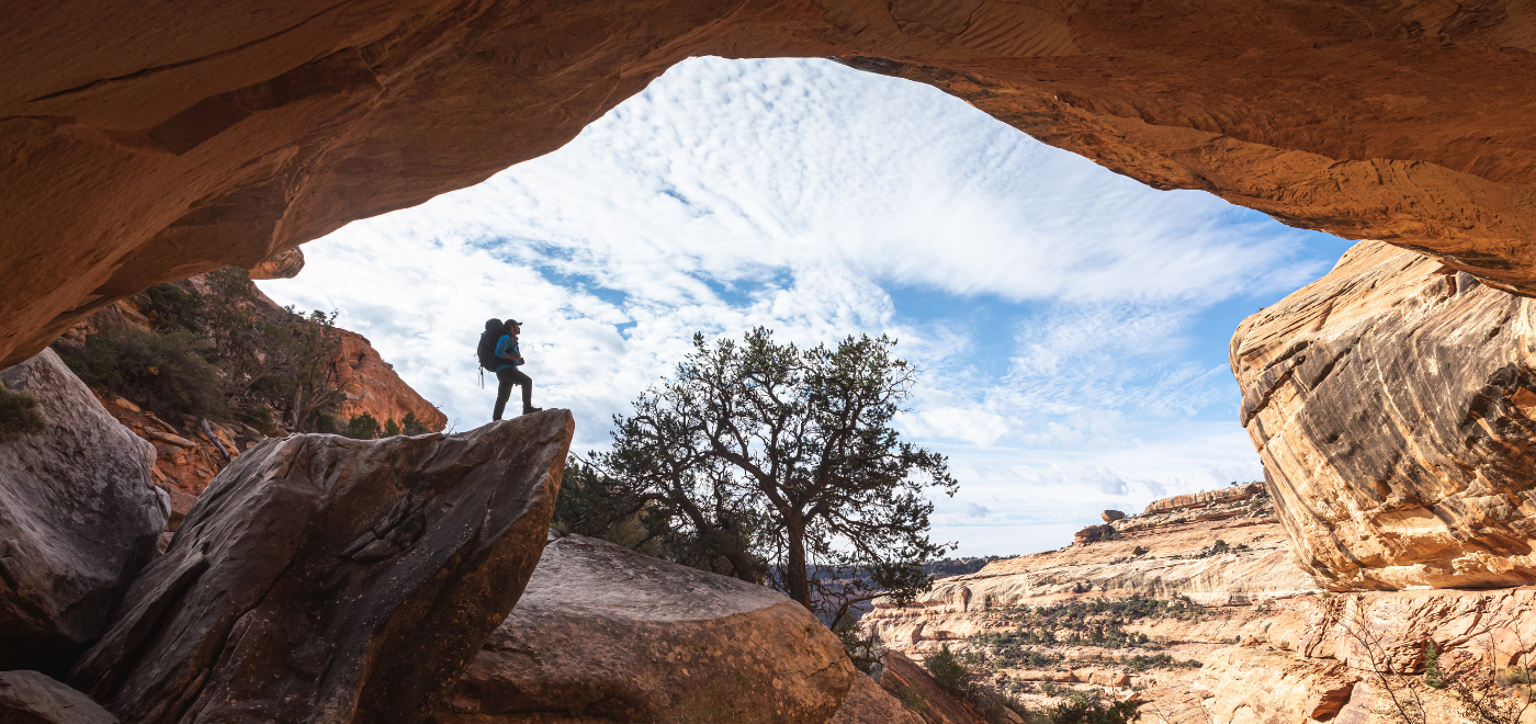 Man enjoying a hike with the basic hiking gear for beginners