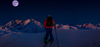 Man backcountry skiing in the dark