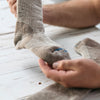 a person holding a FITS sock